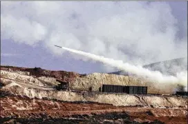  ?? ASSOCIATED PRESS ?? Turkish artillery forces in Hatay, Turkey, fire toward Syrian Kurdish positions in the Afrin area of Syria on Friday. Turkey’s military said its jets hit 19 targets, including shelters, ammunition depots and gun positions belonging to “terror”...