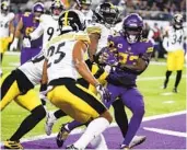  ?? BRUCE KLUCKHOHN AP ?? Vikings running back Dalvin Cook (33) scores on a 7-yard touchdown run during the first half.