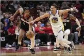  ?? DAVID J. PHILLIP — THE ASSOCIATED PRESS ?? Houston Rockets’ Josh Christophe­r (9) steals the ball from Golden State Warriors’ Jordan Poole (3) during the first half on Monday in Houston.