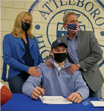  ?? Matt stOne PhOtOs / heraLd staFF ?? STAYING LOCAL: Attleboro football star Michael Strachan Jr. signs his National Letter of Intent to attend the University of Rhode Island on a scholarshi­p, with his parents Ulrica and Mike, at Attleboro High School on Wednesday. At left, Strachan Jr. shakes hands with principal Bill Runey before signing his letter.