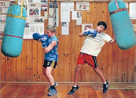  ?? Photo: MYTCHALL BRANSGROVE/FAIRFAX NZ ?? Ready to rumble: Corbin Gillespie, left, and Joel Hill knuckle down to training ahead of the South Island Golden Gloves Championsh­ips at Timaru this weekend.