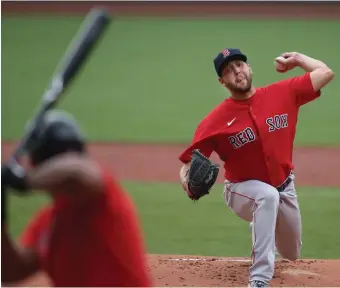  ??  ?? DEALING: Left-handed pitcher Matt Hall threw three solid innings during Monday’s intrasquad game. Below, Hall leaves the bullpen with Christian Vazquez.