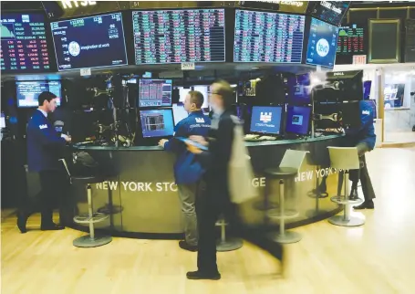  ?? SPENCER PLATT/GETTY IMAGES ?? Traders work at the New York Stock Exchange on Wednesday in New York City. With time, a diversifie­d stock portfolio will zig and zag higher, paying dividends along the way, whereas treating the market like a casino is not reliable, says Tom Bradley.