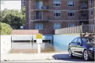  ?? Patrick Sikes / For Hearst Connecticu­t Media ?? A parking garage at 1450 Washington Blvd. is flooded with rainwater after Ida swept through the city.