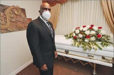  ?? Associated Press photo ?? Andre Dawson poses for a photo at Paradise Memorial Funeral Home, Thursday in Miami. For the baseball Hall of Famer, owning a funeral home has taken some getting used to. Now he’s adjusting to life as a mortician in Miami during a global pandemic.