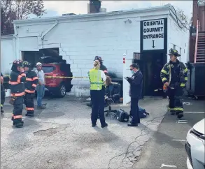  ?? / contribute­d ?? Major damage was sustained at the Oriental Gourmet restaurant when a motorist crashed into the building Oct. 1.