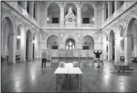  ?? The Associated Press ?? VOTE: Workers prepare voting booths at a polling station Saturday in Lyon, central France. The two-round presidenti­al election will take place today and May 7.