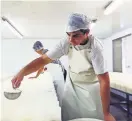 ?? CHARLY TRIBALLEAU/ AGENCE FRANCE-PRESSE — GETTY IMAGES ?? France is relaxing rules on cheese labeling. Making Camembert in Normandy.