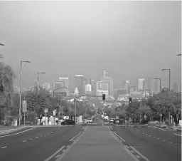  ?? THOMAS HAWTHORNE/THE REPUBLIC ?? Air pollution is seen over a hazy downtown Phoenix on Jan. 2, 2020.