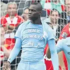  ??  ?? Mario Balotelli sporting his famous T-shirt in the 6-1 win at Old Trafford