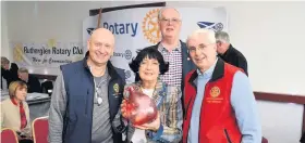  ??  ?? Guest Anita Manning with members of the Rotary at the event
