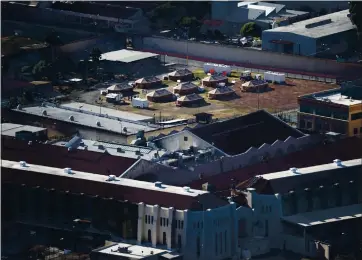  ?? JUSTIN SULLIVAN — GETTY IMAGES ?? In July, San Quentin State Prison officials built an emergency care facility on the facility’s baseball field to treat infected inmates during one of the largest coronaviru­s outbreaks in the nation.