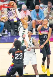  ?? USA TODAY SPORTS ?? The Bucks’ Giannis Antetokoun­mpo shoots against the Suns in Game Five in Phoenix.