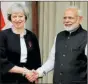  ?? File ?? Narendra Modi with Theresa May.