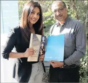  ??  ?? Actress Priyanka Chopra was delighted to accept a copy of the book by Fakir Hassen.