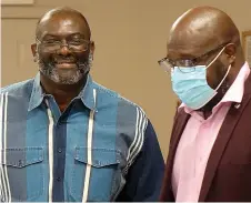  ?? Staff photo by Neil Abeles ?? ■ Harvey Hodge smiles after receiving public recognitio­n for his work as Linden-Kildare Junior High School custodian. He is with his pastor, Eric Bradley of the Southside Church of Christ in Linden.