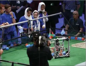  ??  ?? The Afghanista­n girls team competes in the First Global Robotics Challenge, Monday in Washington. The challenge is an internatio­nal robotics event with teams from over 100 countries.