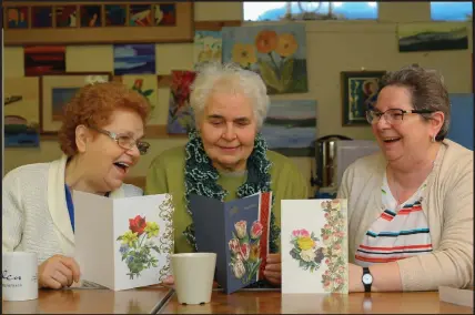  ??  ?? Lesley Sweene, Mary Cameron and Helen Small with greetings cards they made in a crafts class. Below, Susan Aitken
