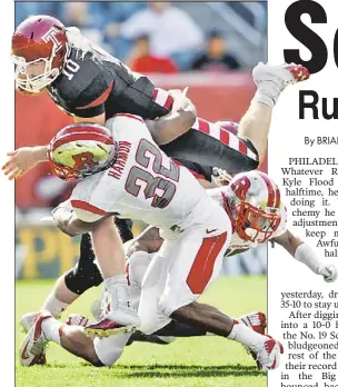  ?? AP ?? OWL GET YOU: Rutgers’ Duron Harmon brings down Temple QB Chris Coyer during the Scarlet Knights’ 35-10 triumph yesterday in Philadelph­ia.