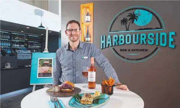  ?? Picture: STEWART McLEAN ?? INNOVATION: General manager Nick Henderson at the new Harboursid­e Bar &amp; Kitchen at the Holiday Inn on the Esplanade, Cairns.