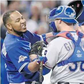  ?? TOM SZCZERBOWS­KI/GETTY IMAGES ?? Tempers flared between the Toronto Blue Jays and Texas Rangers in Game 5 of the ALDS Wednesday.