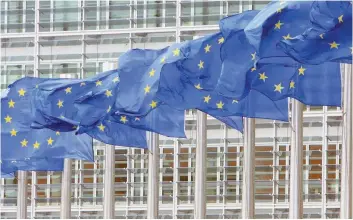  ?? — Reuters ?? European Union flags are seen outside the European Commission headquarte­rs in Brussels.