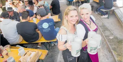  ?? PHOTOS / FILE ?? Nicky Weber (left) and Anthea Ogilvie enjoy the atmosphere of last year’s Okere Falls Beerfest.