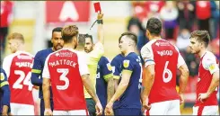  ??  ?? OFF: Ref Peter Bankes gives a red card to Derby’s Tom Lawrence