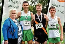  ??  ?? WINNING FEELING: David Flynn (second from right) after winning the Irish Runner 10 Mile Race last July