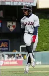  ?? JIM MONE — THE ASSOCIATED PRESS ?? Francisco Lindor celebrates as he rounds the bases on a grand slam by Carlos Santana in the 10th inning.