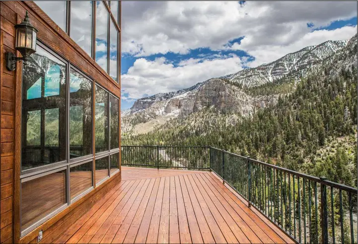  ?? Tonya Harvey Real Estate Millions ?? This home at Mount Charleston has a wraparound deck with views of the Spring Mountains and a forest of pine trees. It’s on the market for $1.2 million.
