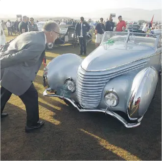  ?? MICHAEL FIALA/ GETTY IMAGES ?? A 1937 Delahaye 145 Franay Cabriolet was one of the more rare luxury cars shown at the Concours d’Elegance car show Sunday in Pebble Beach, Calif.