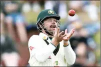  ?? ?? Australia’s Travis Head catches out New Zealand’s Blundell on the fourth day of their cricket test match in Wellington, New Zealand. (AP)