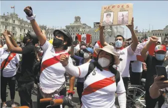  ?? Martin Mejia / Associated Press ?? Peruvians celebrate the resignatio­n of interim President Manuel Merino at Plaza San Martin in Lima. Merino stepped down just days after Congress ousted President Martin Vizcarra.