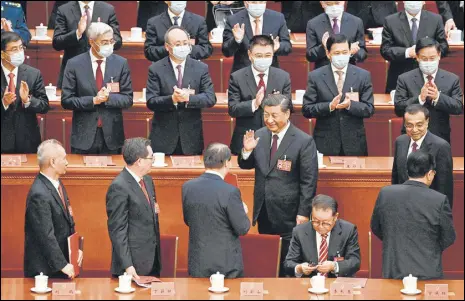  ?? AFP ?? Chinese President Xi Jinping (centre) gestures during the closing ceremony of the CPC Congress in Beijing on Saturday.