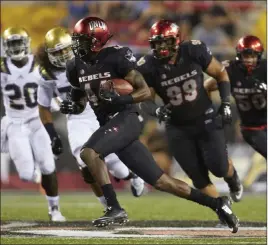  ?? R. Marsh Starks ?? UNLV Photo Services Former UNLV safety Kenny Keys, shown during his 34-yard intercepti­on return in the Rebels’ 37-3 loss to UCLA in 2015, has died, the university announced. He was 25.