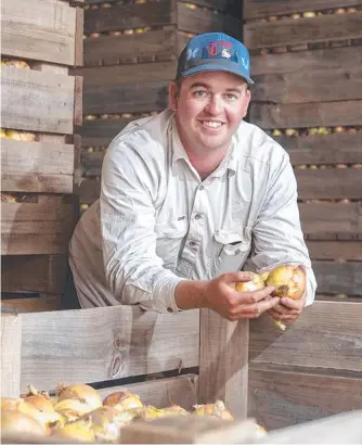  ?? ?? WORKERS SOUGHT: Onion grower Joseph Kluck is among the Lockyer Valley farmers hunting for people willing and able to pick and pack produce.