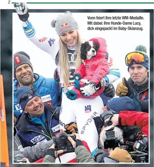  ??  ?? Vonn feiert ihre letzte WM-Medaille. Mit dabei: Ihre Hunde-Dame Lucy, dick eingepackt im Baby-Skianzug.