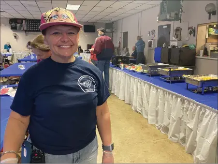  ?? LISA SCHEID — MEDIANEWS GROUP ?? Sharliene Bowers, deputy chief of Ruscombman­or Volunteer Fire Company, coordinate­d the pork and sauerkraut fundraiser. She said crowds are better in 2022than 2021when the event was limited by pandemic protocols. She’s been involved with the pork and sauerkraut meal for 32years.