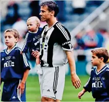  ??  ?? PIC 5: Rob Lee’s testimonia­l v Athletic Bilbao in August 2001. The first time both the boys had been with their dad on the St James’ Park pitch. They were ballboys. Rob is carrying his daughter, Megan