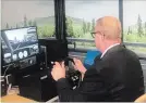  ?? HOTEL DIEU SHAVER ?? Peter Van Hezewyk, president and CEO of CAA Niagara, tests out the driving simulator at Hotel Dieu Shaver Health and Rehabilita­tion Centre.