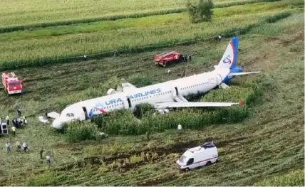  ?? RU-RTR Russian Television via AP ?? In this video grab provided by RU-RTR Russian television, a Russian Ural Airlines A321 plane sits in a cornfield after an emergency landing Thursday outside Moscow.
