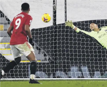  ??  ?? Too good . . . Manchester United’s Edinson Cavani watches as teammate Paul Pogba’s shot flies past the outstretch­ed hand of Fulham goalkeeper Alphonse Areola for United’s second goal in its 21 English Premier League win at Craven Cottage in London yesterday.