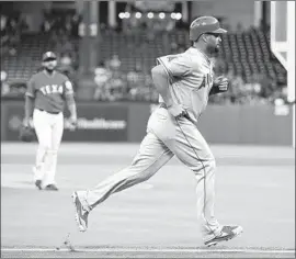  ?? Ronald Martinez Getty Images ?? ALBERT PUJOLS, scoring the second of the Angels’ three runs in the first inning, singled twice and needs only 17 hits to run his career total to 3,000.