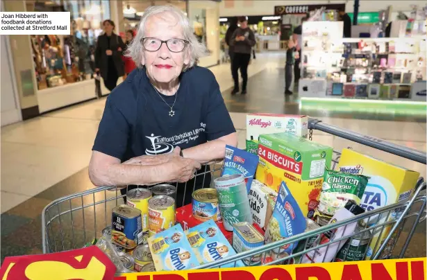  ??  ?? Joan Hibberd with foodbank donations collected at Stretford Mall