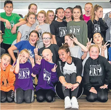  ??  ?? Lily is pictured in the centre of the front row with Jackie Nicoll of JGN Dance Attic and other JGN dancers.