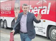  ?? CP PHOTO ?? Nova Scotia Premier Stephen McNeil arrives for an infrastruc­ture announceme­nt as he campaigns in Halifax on Monday. The provincial election will be held Tuesday, May 30.