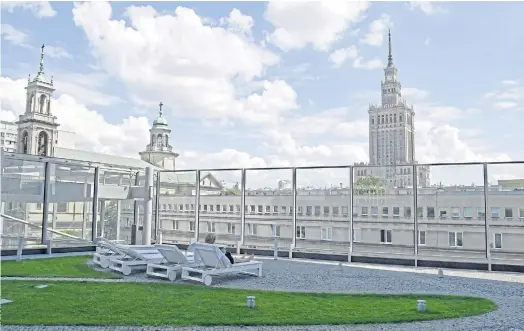  ??  ?? ROOF WITH A VIEW: A recreation zone at the Cosmopolit­an apartment tower in Warsaw.