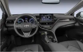  ?? ?? The interior of the 2023 Camry Hybrid XSE has a sporty feel. The leather seats seem harsh at first but they provided comfort during a high-mileage test week.