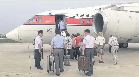  ?? AP ?? In this June 27, 2016, file photo, passengers board an Air Koryo flight headed for Beijing.